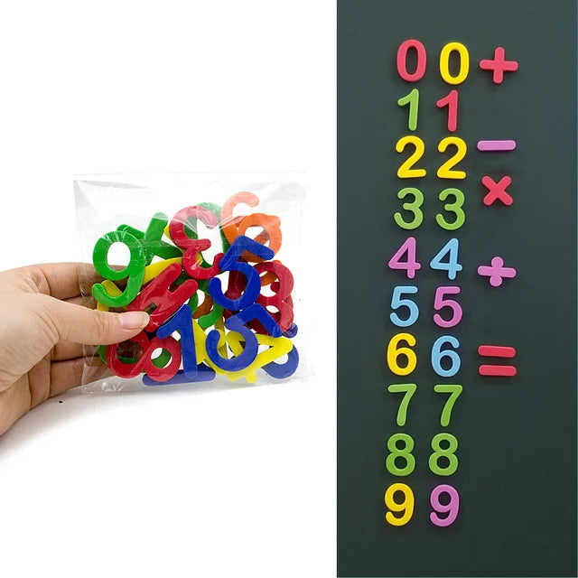A hand holds a clear bag of colorful magnetic alphabet numbers arranged in a vertical sequence.