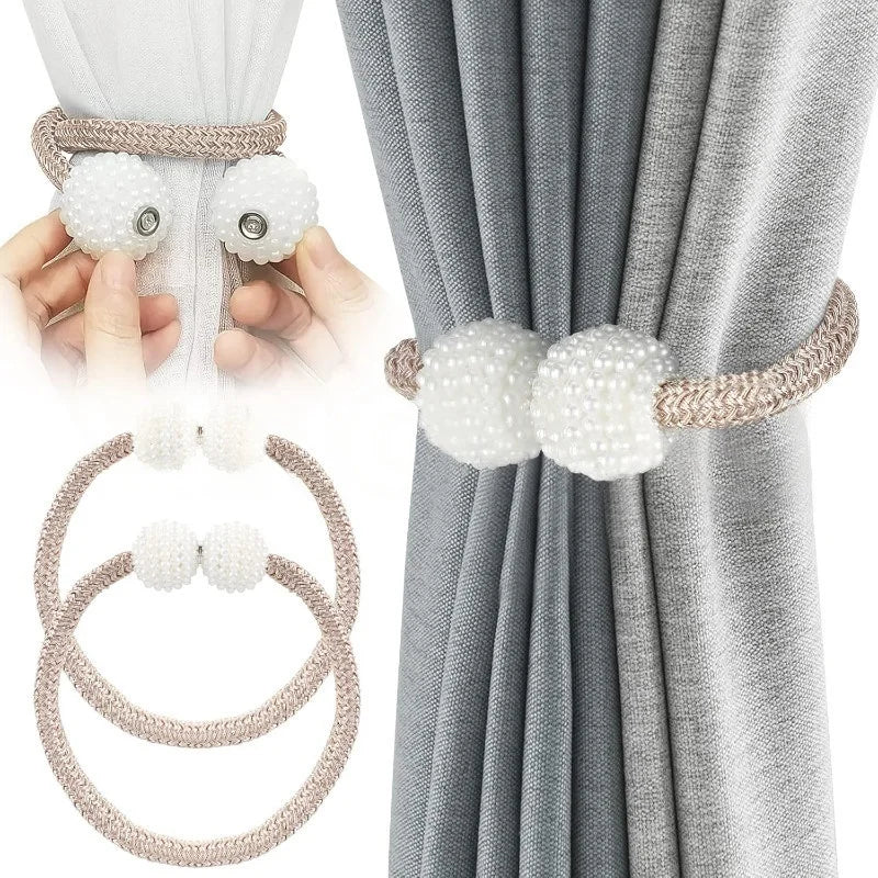 Pearl magnetic curtain tiebacks with a beige cord and pearl accents shown in use on a gray curtain.