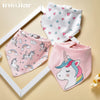 A set of three soft cotton baby bibs featuring various pastel-colored cartoon prints including unicorns and hearts.