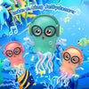 Three colorful jelly dancers with LED lights float in blue water against a bright background.