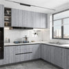 Modern kitchen cabinet installation featuring light gray wood grain vinyl wallpaper and stainless steel appliances.