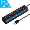 A black USB 2.0 multi-port hub with seven ports and blue LED indicators is shown connected by a cable.