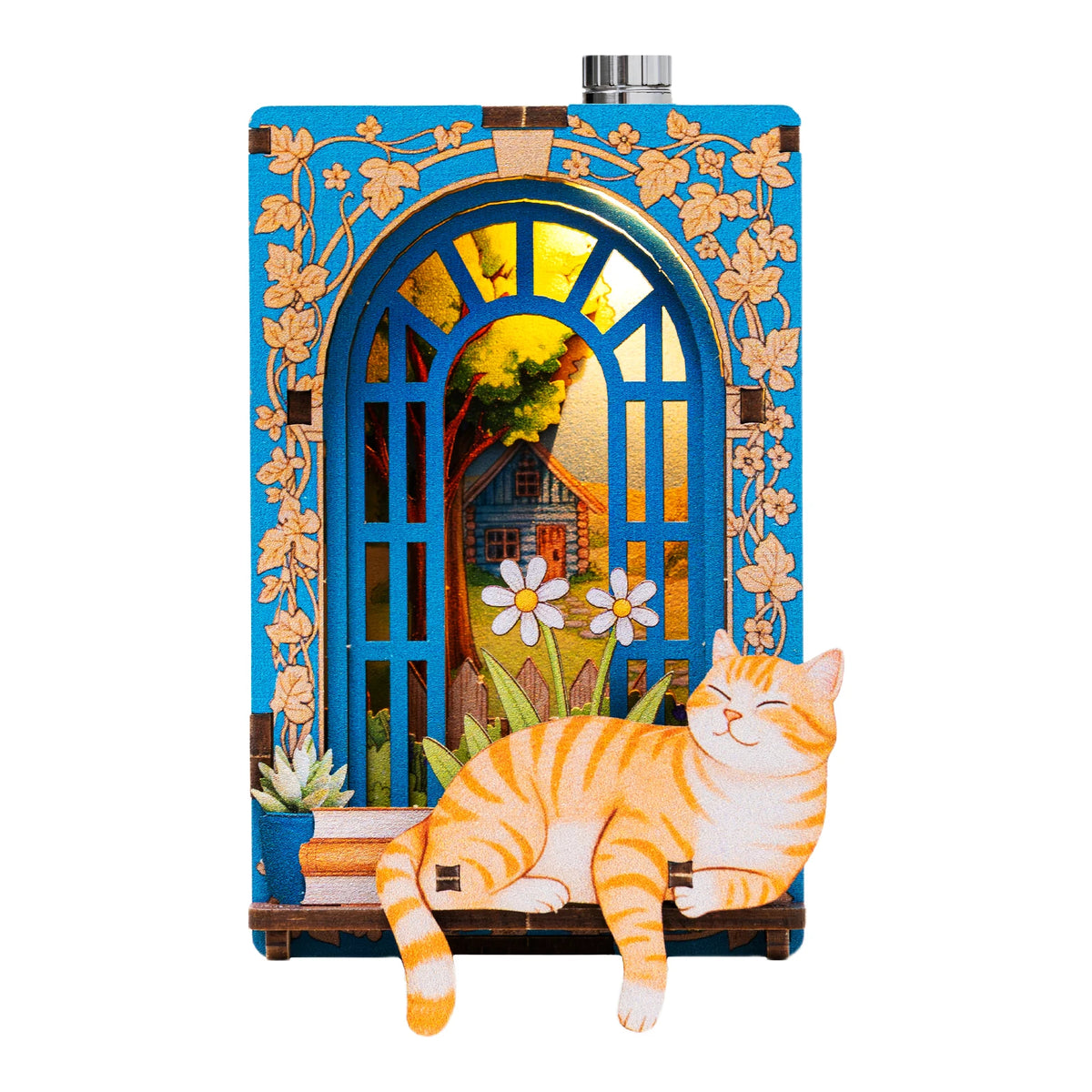 A decorative wooden frame featuring a stained glass window depicting a house and flowers, with an orange tabby cat sitting in