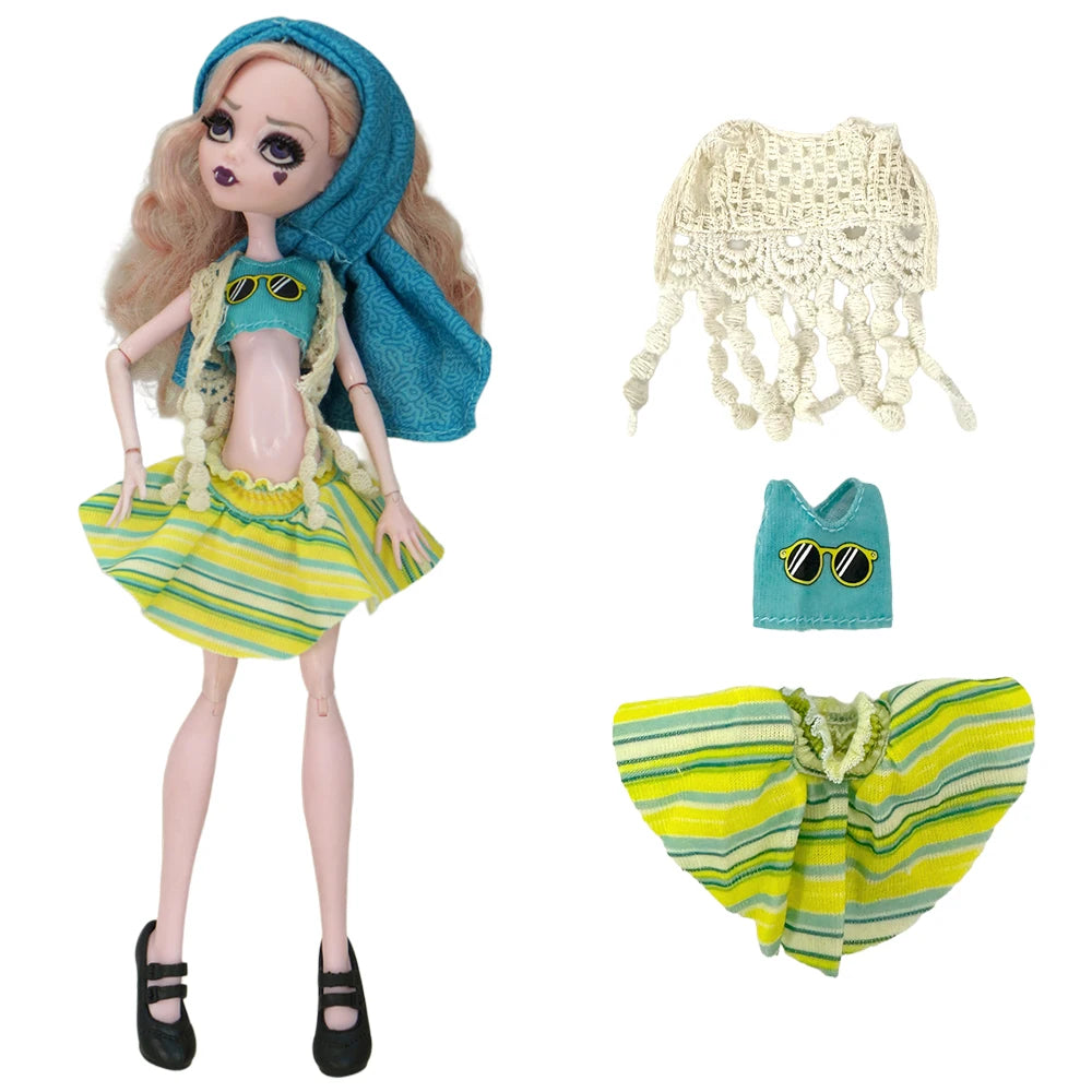 A fashion doll outfit featuring a yellow striped dress, blue fabric, and a cream crochet accessory.