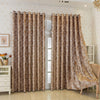 A pair of brown tree bark jacquard blackout curtain panels hanging in a light-colored room.