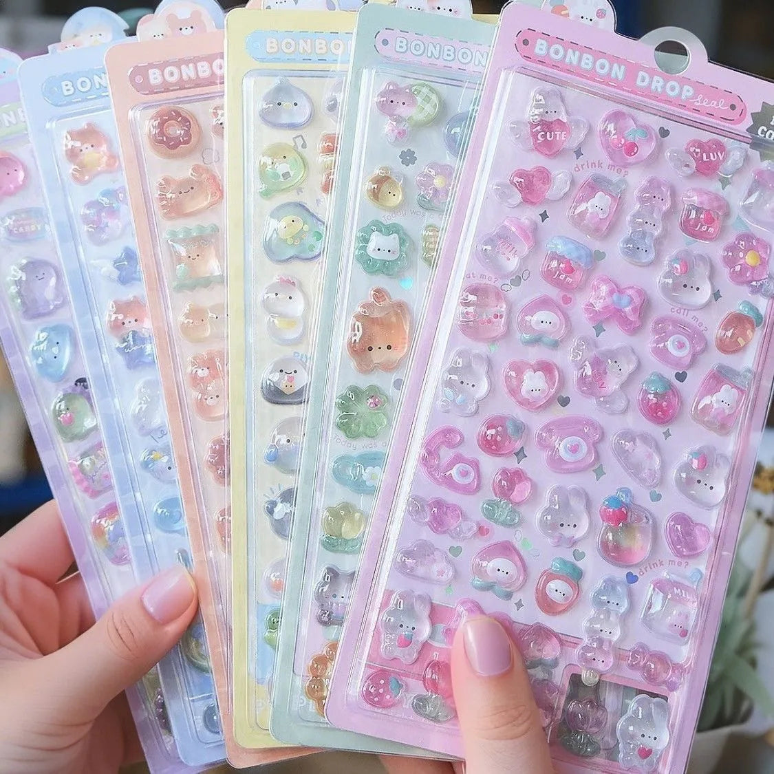 A collection of pink and pastel jelly stickers featuring cute cartoon animals and ghost rabbits.
