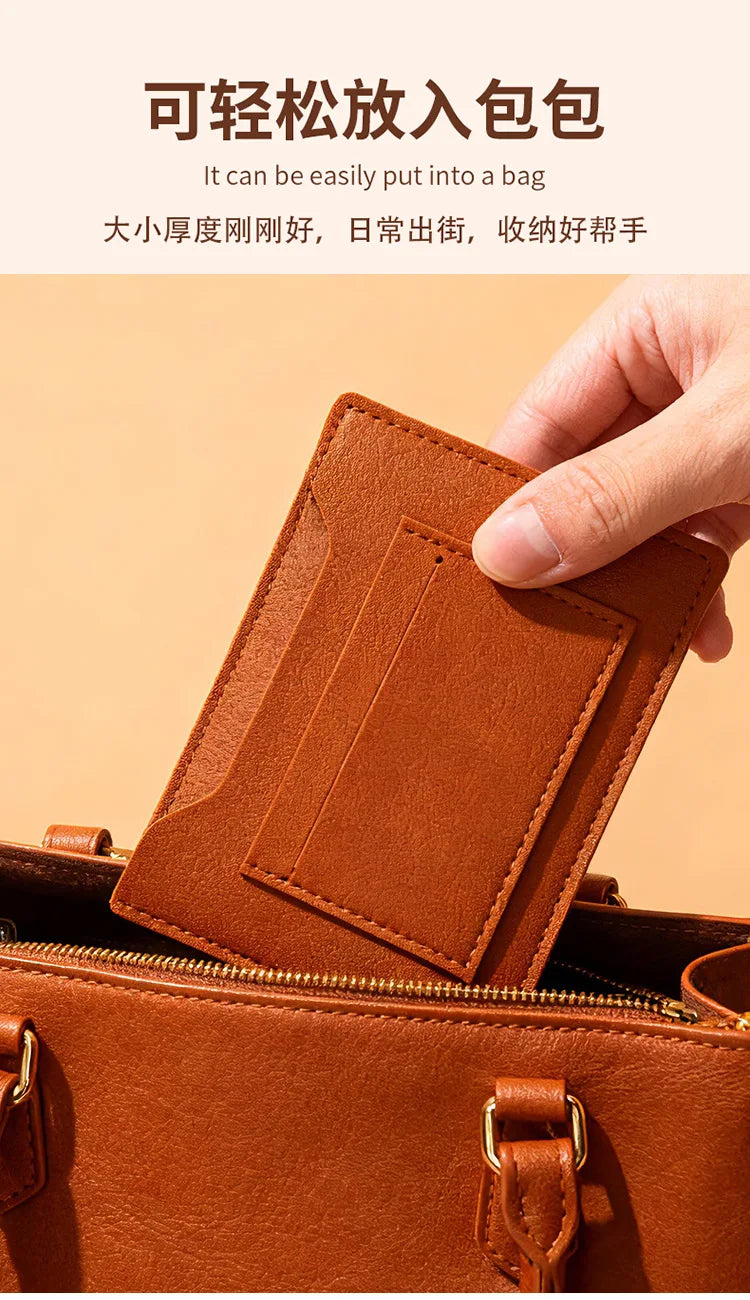 A close-up of a brown leather passport holder being placed into a handbag.