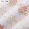 Light pink wallpaper featuring delicate gold floral embroidery and leaves.