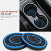 A set of two black and blue silicone non-slip coasters designed for car cup holders.
