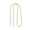 A delicate gold-toned chain shoulder strap buckle for crossbody bags.