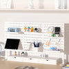 A white desktop pegboard organizer with multiple shelves, hooks, and storage compartments for office or craft supplies.