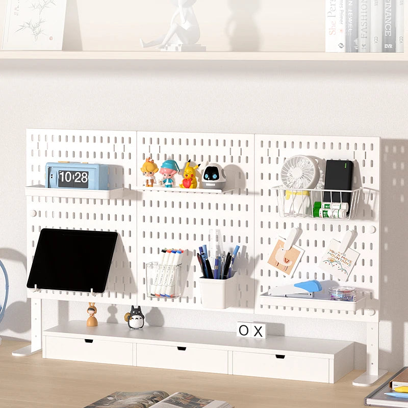 A white desktop pegboard organizer with multiple shelves, hooks, and storage compartments for office or craft supplies.