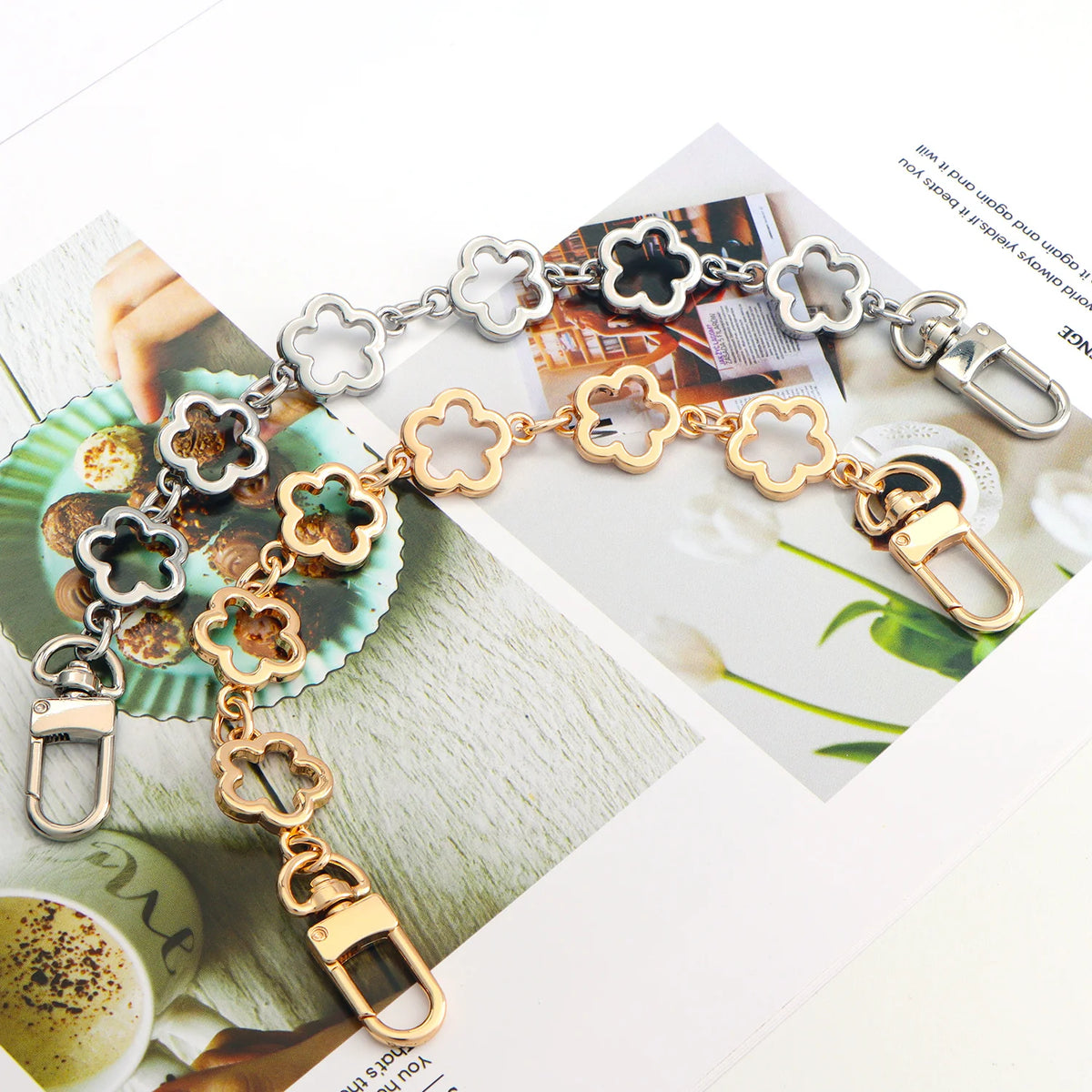A close-up of a gold and silver adjustable flower bag chain extender for handbags and purses.