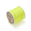 Spool of bright yellow 0.8mm nylon macramé cord for jewelry making