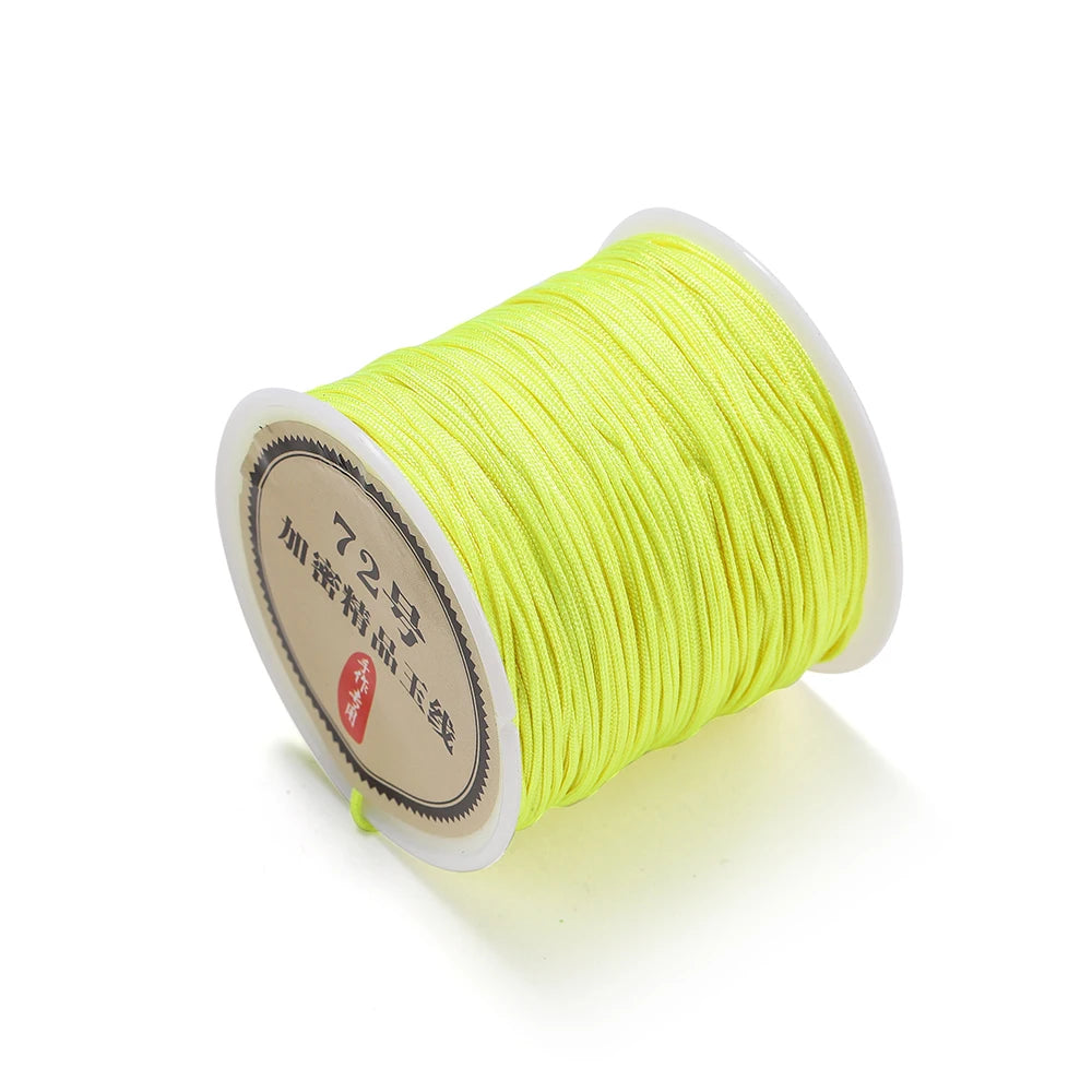 Spool of bright yellow 0.8mm nylon macramé cord for jewelry making