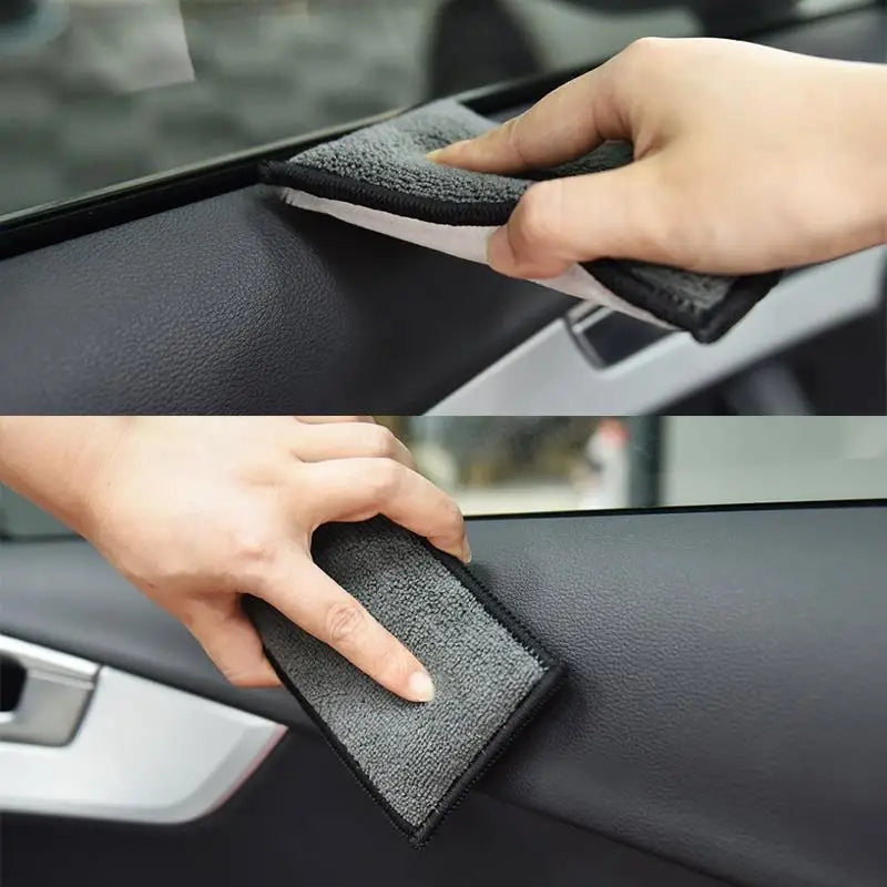 A hand is using a dual-sided microfiber scrubbing sponge to clean the interior of a car door panel.