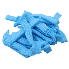 A pile of light blue disposable hair net caps for microblading and permanent makeup.
