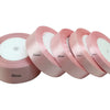 Rolls of light pink satin ribbon measuring 6mm to 40mm wide.