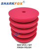 Set of five red finishing polish foam pads for car polishing