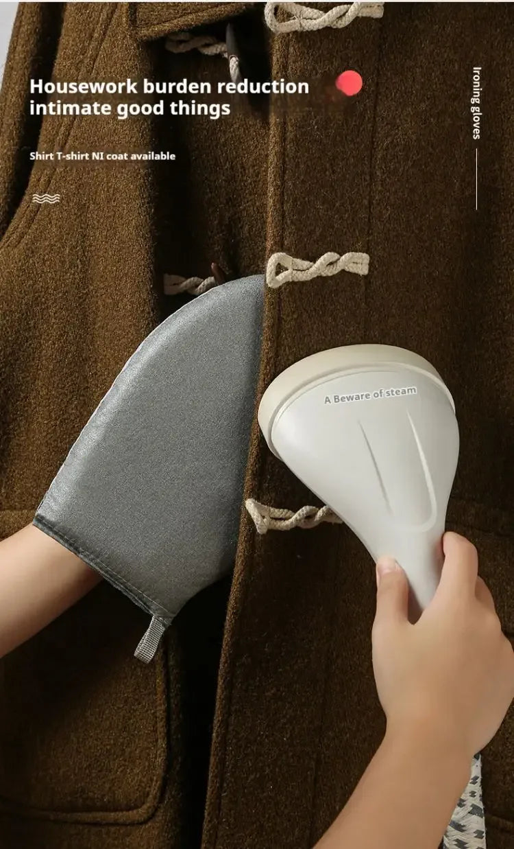 A hand holds a white portable ironing board glove against a brown coat.