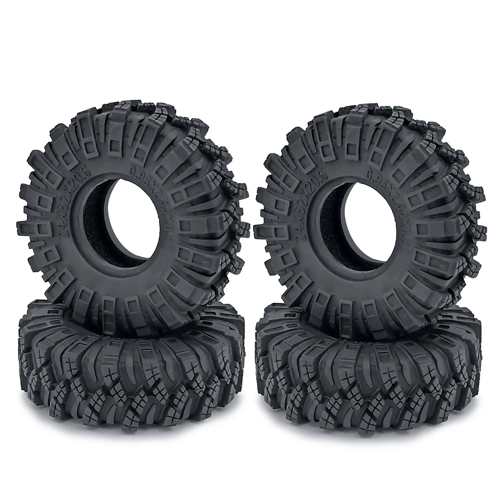 A pair of black rubber mud terrain tires for Axial SCX24 and TRX4M