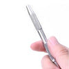 A hand holds a silver 4-prong precision pick-up claw tool for jewelry making.