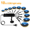 Ten cobalt blue light strips with black wires and connectors displayed on a white background.