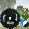 A close-up view of a black brush cutter blade with green accents and mounting hardware against a blurred outdoor background.
