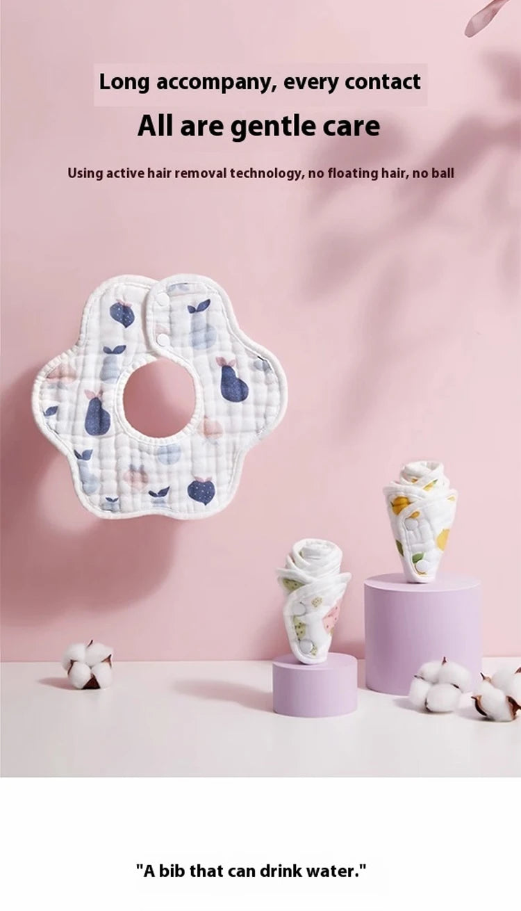 A pack of soft cotton muslin bandana bibs for babies with a floral pattern displayed on a pink background.