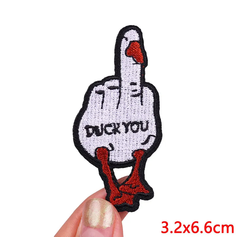 Embroidered iron-on patch of a duck hand with the text DUCK YOU