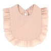 A light pink, textured cotton baby bib in a bandana style with ruffled edges.