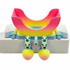 A pink and yellow 3D sponge holder with a hanging design for the kitchen sink.
