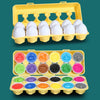 A yellow plastic container holds white eggs and a separate tray contains colorful plastic shapes for toddlers.