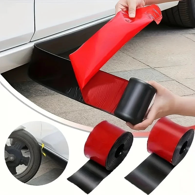 A hand is applying a red and black self-adhesive PVC strip to protect a car's side skirt or door edge.