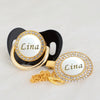 Gold and white rhinestone pacifier with a clip featuring the name Lina