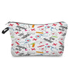 A pink and white fabric makeup bag with a zipper closure featuring various nurse-themed graphics like crosses, stethoscopes, 