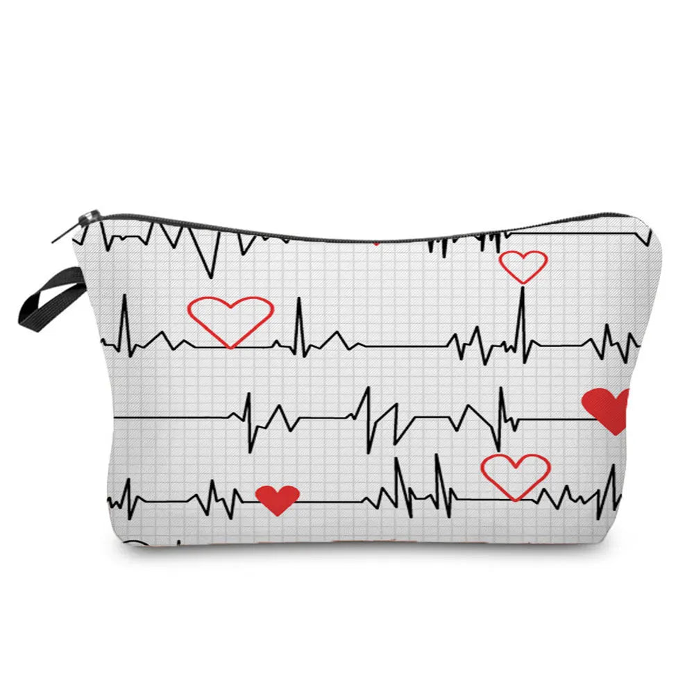 A black fabric makeup bag featuring an ECG heartbeat line print with red heart accents.