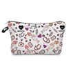 A pink and black patterned makeup bag featuring various medical and nurse-themed icons like a heart ECG monitor and syringe.