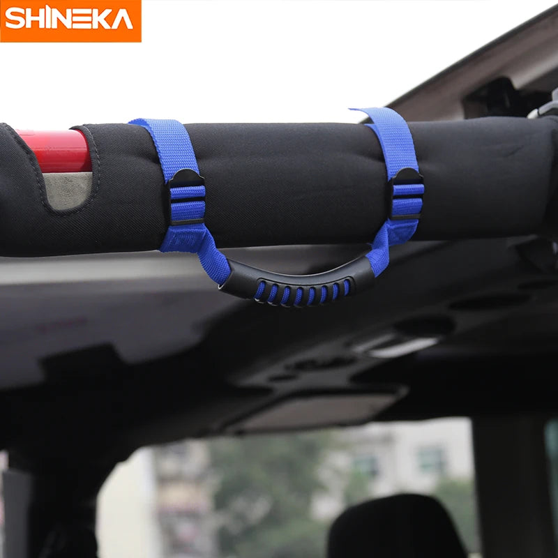 Blue pull tabs on a black roll bar mount armrest for Jeep Wrangler grab handles