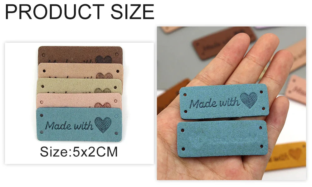 A hand holds several rectangular heart-shaped leather labels of various colors and shades.