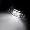 A close-up, black and white photo of a pair of LED side marker clearance lights.
