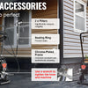 A professional airless paint sprayer with an extension pole, rubber hose, and wheels being used outdoors.