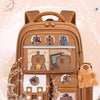 A brown fabric backpack featuring cute capybara designs and water-repellent features.