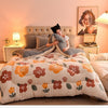 A cozy double-sided velvet warm quilt blanket is displayed on a bed with soft lighting.
