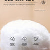 Close-up of white feather velvet filling material used in a cozy blanket with text describing its features.
