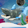 A gray shark toy with a swivel wheel design is shown swimming in blue water.