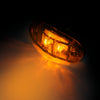 A pair of red, white, and yellow LED side marker clearance lights illuminated against a dark background.