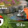An orange gas-powered hedge trimmer is shown trimming weeds without harming stone or brick on a lawn.