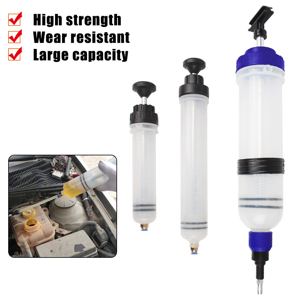 A clear manual fuel transfer and oil extractor syringe with a black cap and blue tip, shown next to an automotive engine cont