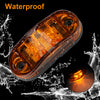 A waterproof LED side marker clearance light is shown being splashed by water.